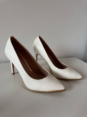 BCBGeneration White Pointed Toe Stiletto Pumps with Gold Trim